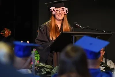 Adult student celebrating graduation achievement